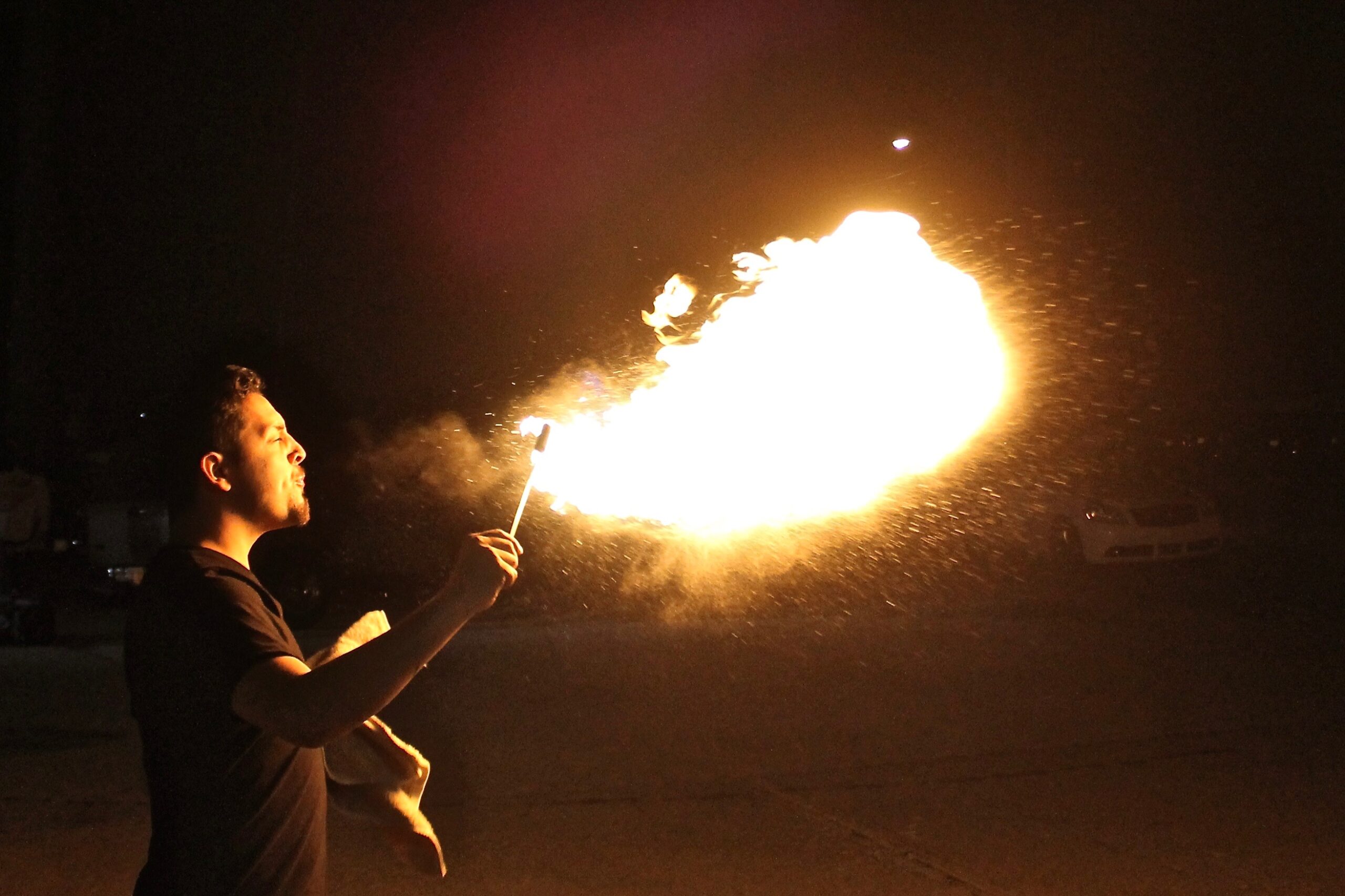 Manuel Garcia breathes fire at the Essex Studios Art Walk